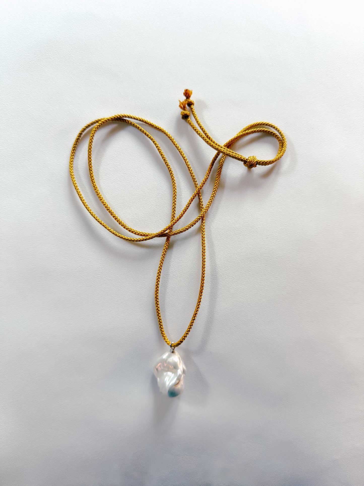 BAROQUE PEARL ON OCHRE KUMIHIMO SILK