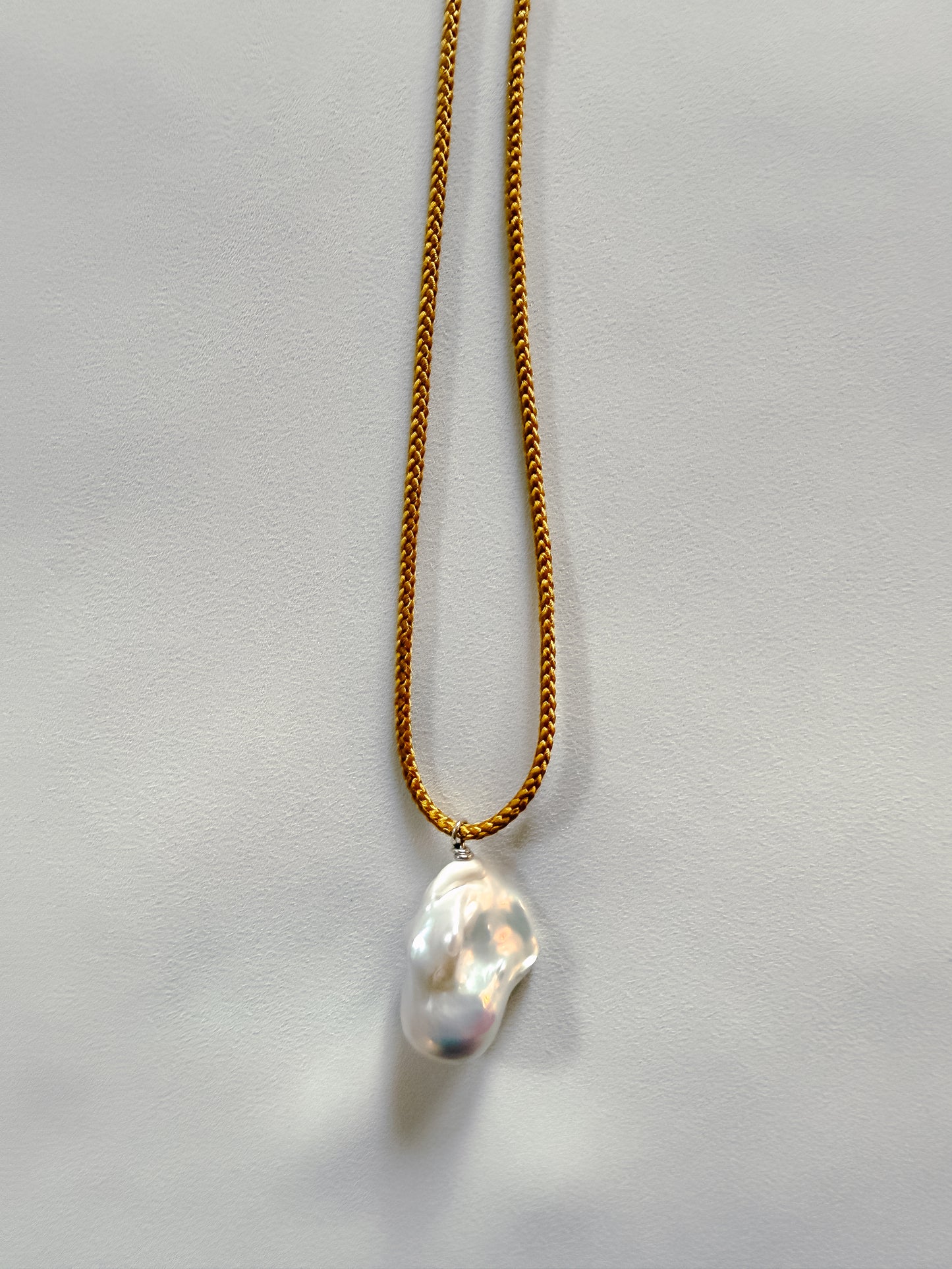 BAROQUE PEARL ON OCHRE KUMIHIMO SILK